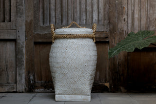 Stylish whitewashed woven bamboo laundry basket with rope lid and handles